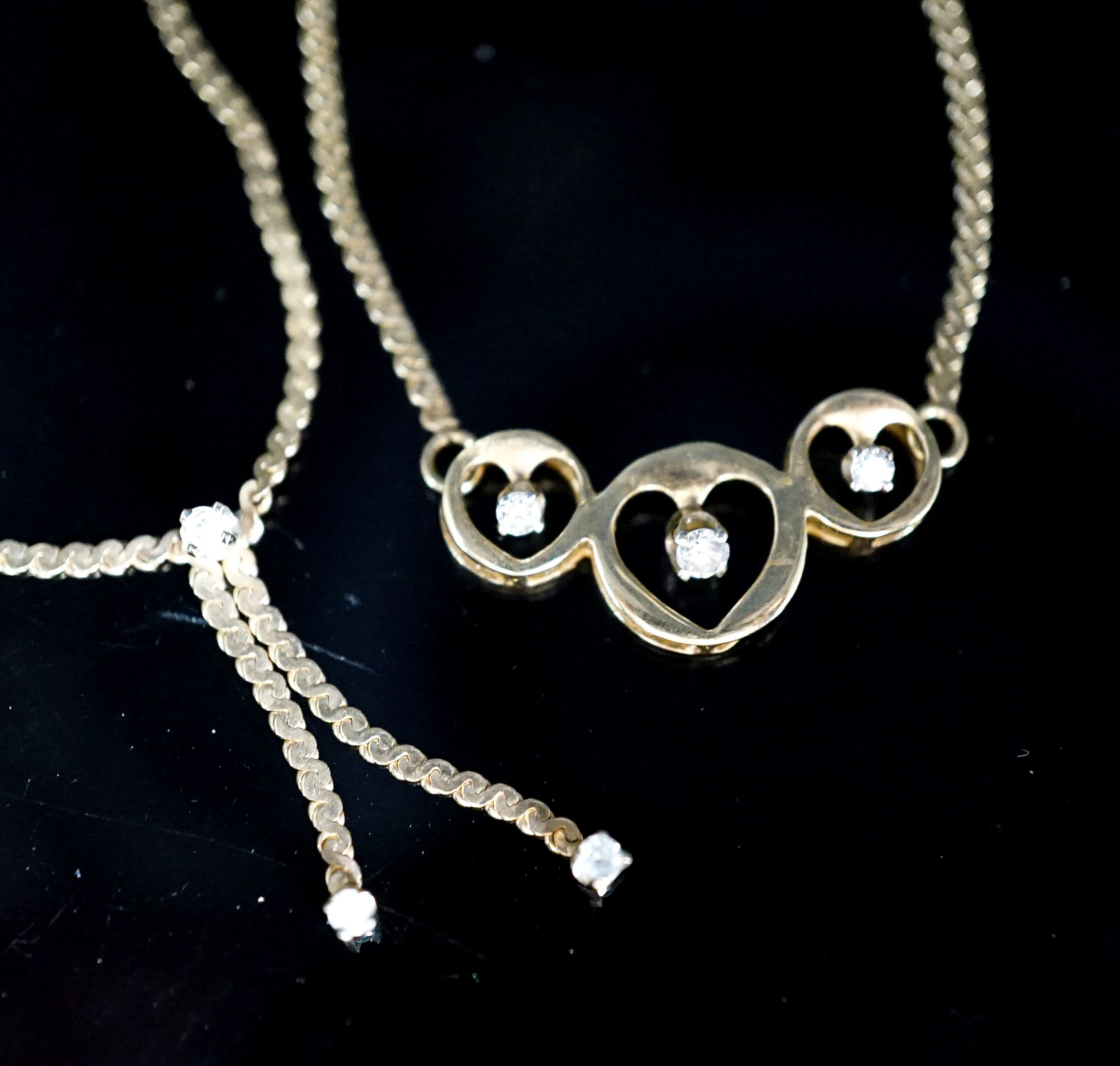 Two modern 14k and diamond chip set necklaces, gross weight 7.7 grams.